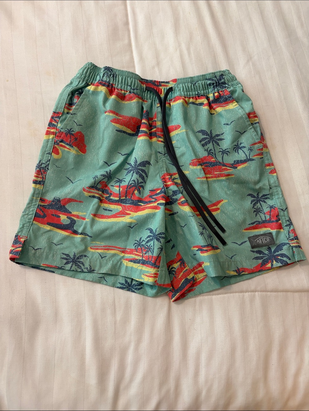 AFTCO Teal Swim Trunks with Red and Yellow Tropical Print